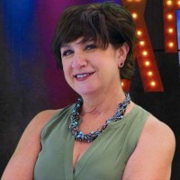 Lara Shipp Smiling woman with short dark hair